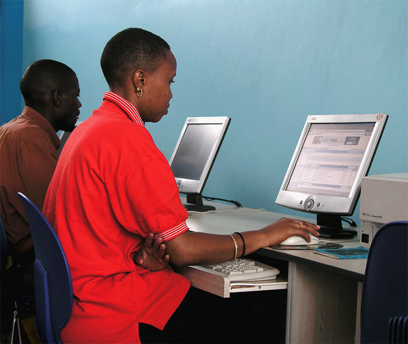 Girl looks at computer. Credit: Arne Hoel/World Bank