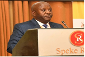 Patrick Mugirwa speaking during a conference.
